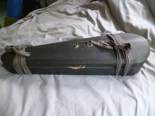 Antique violin case, wrapped to prevent opening