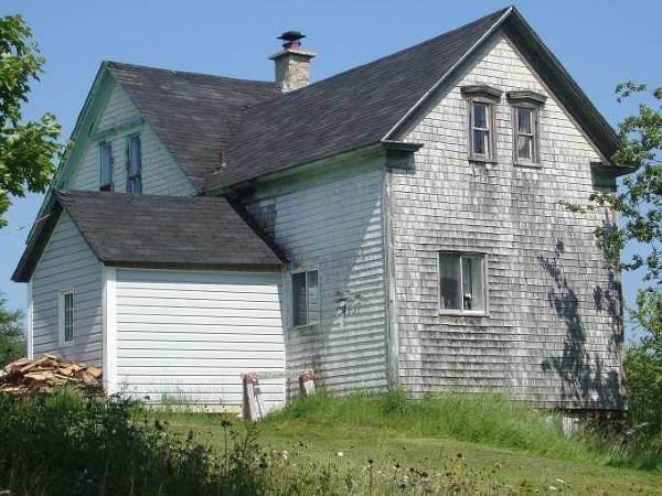 Gothic Revival Farmhouse with shingles