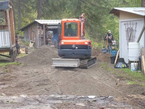 Salvaging the gravel from under the trailer...