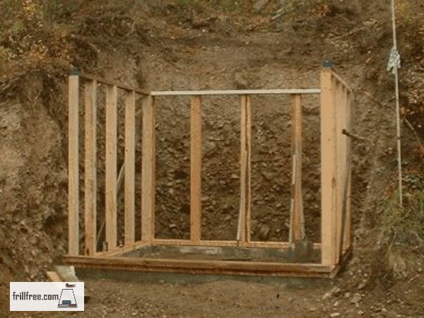 The framework of the earth sheltered root cellar is in place on the footing...