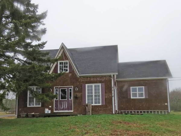 Gothic Revival Farmhouse painted red