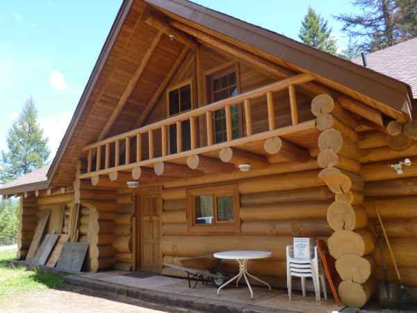 The front door of this great log home is functional and welcoming (if a little sparely furnished!)